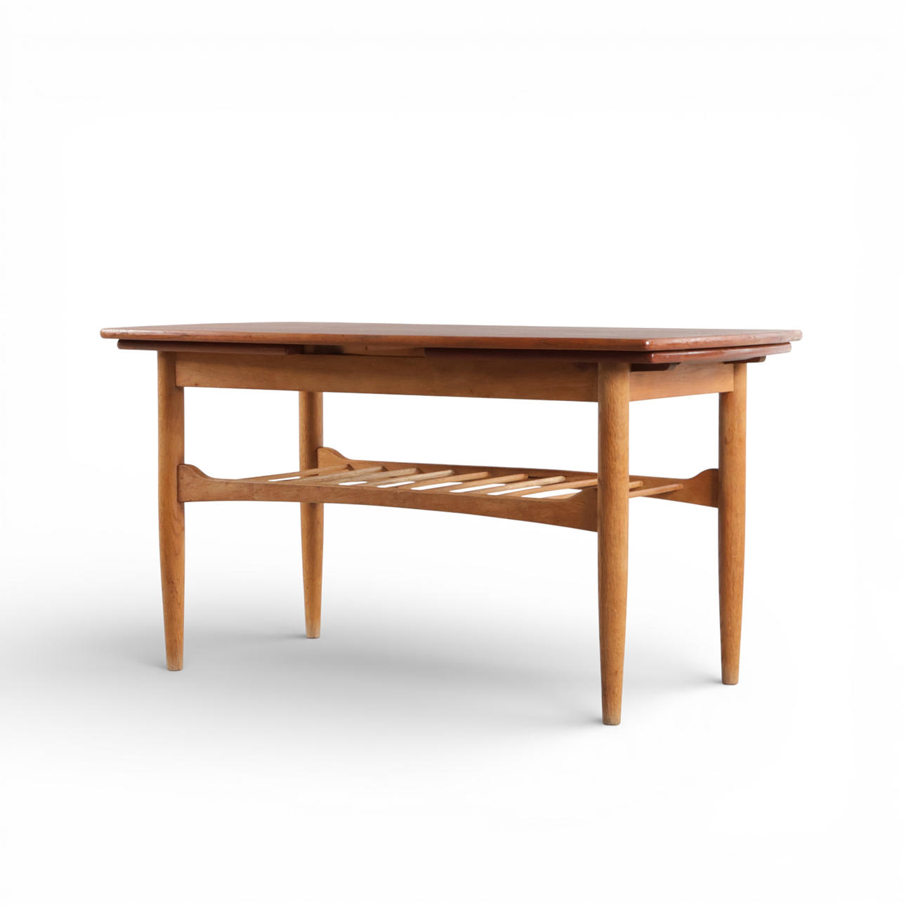 Rectangular coffee table with teak top with pull-out, one pull-out plate with black formica, solid oak frame. Denmark, 1950s.