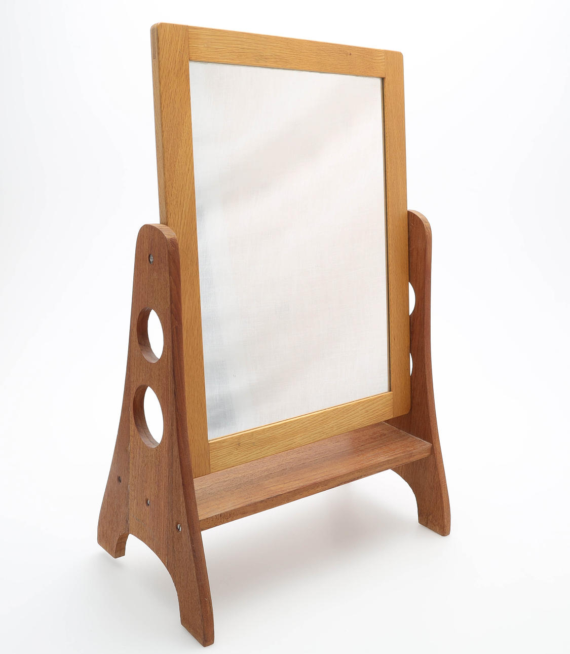 A mid 20th century oak & teak table mirror.