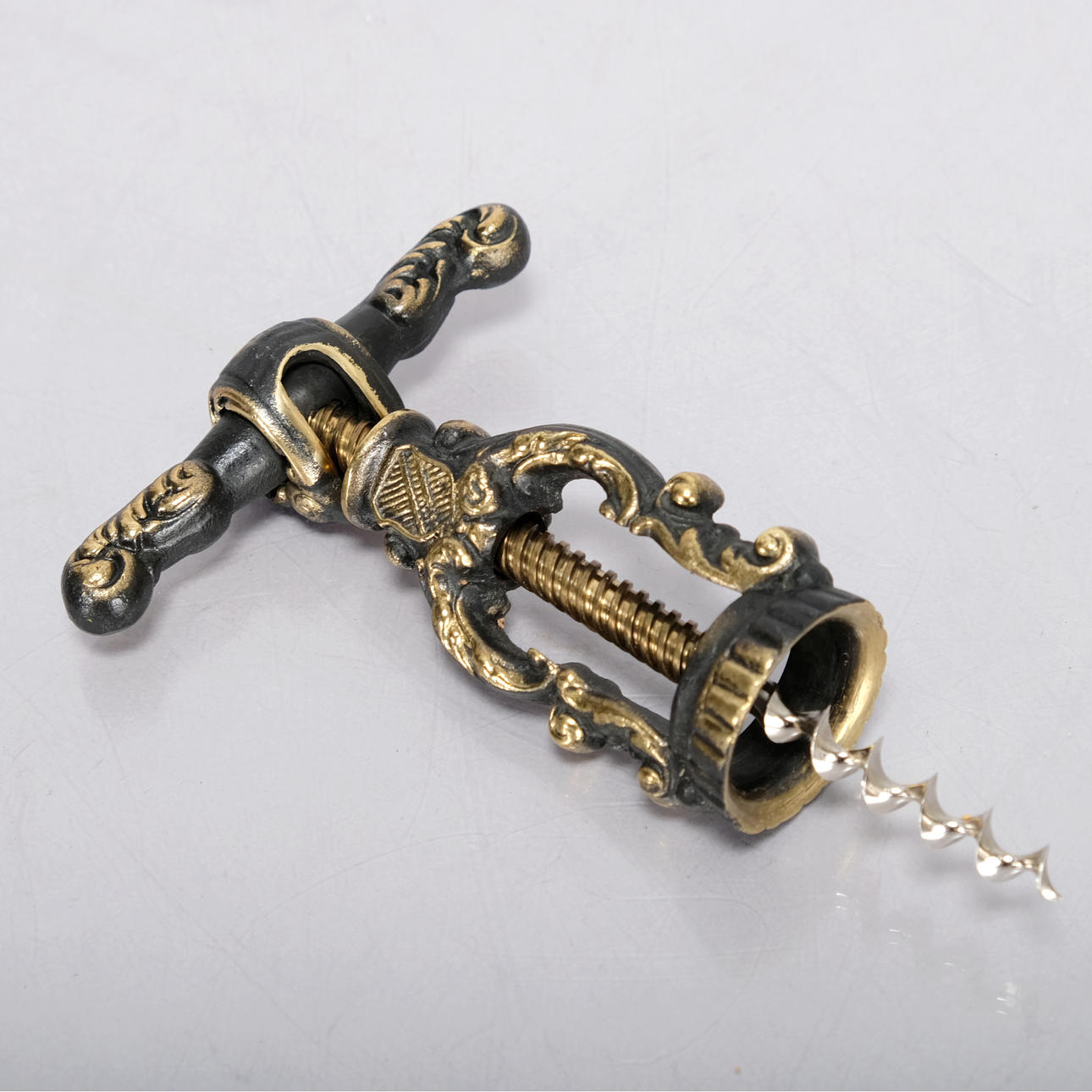 A metal corkscrew, Rococo style, 20th century.