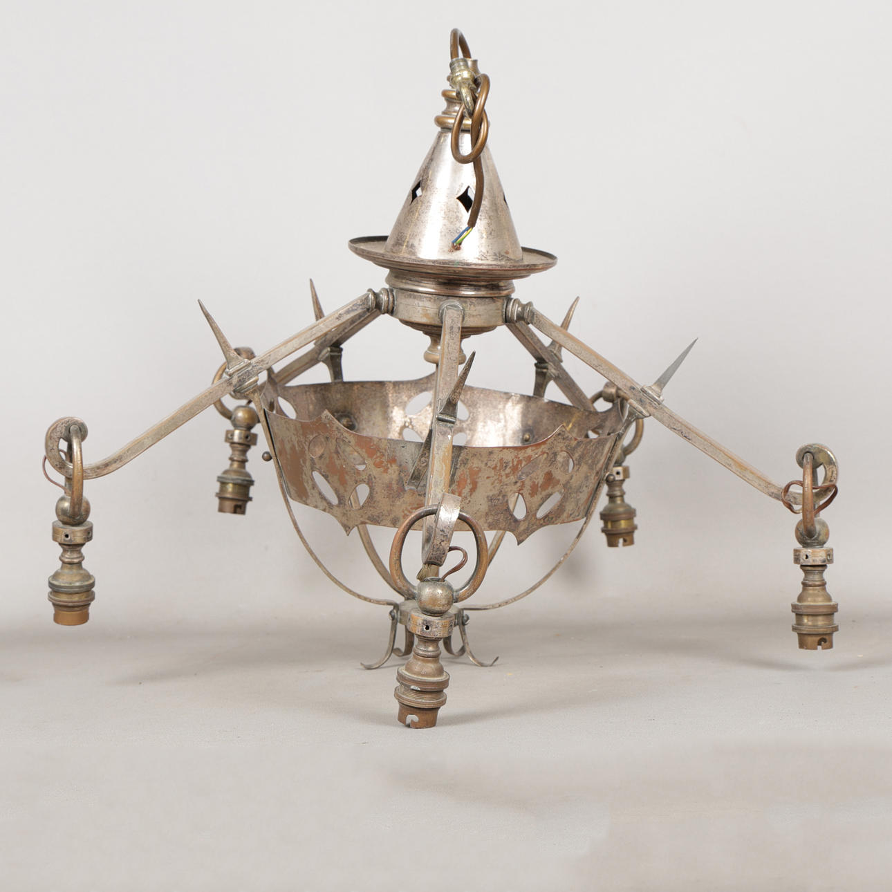 A WHITE METAL CHANDELIER.