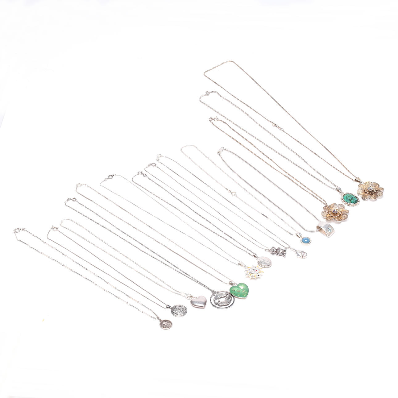 PENDANTS and CHAINS, silver, total weight approx. 93 grams.