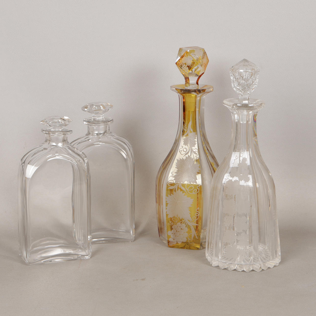 FOUR GLASS DECANTERS TO INCLUDE ETCHED EXAMPLES (4).