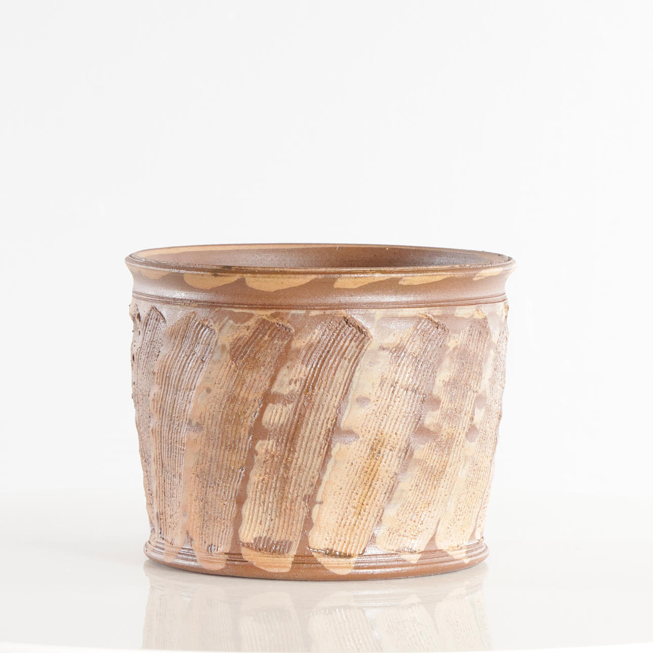 GERTRUD BERG. Ceramic jar with rustic, textured surface and a pattern in brown shades.