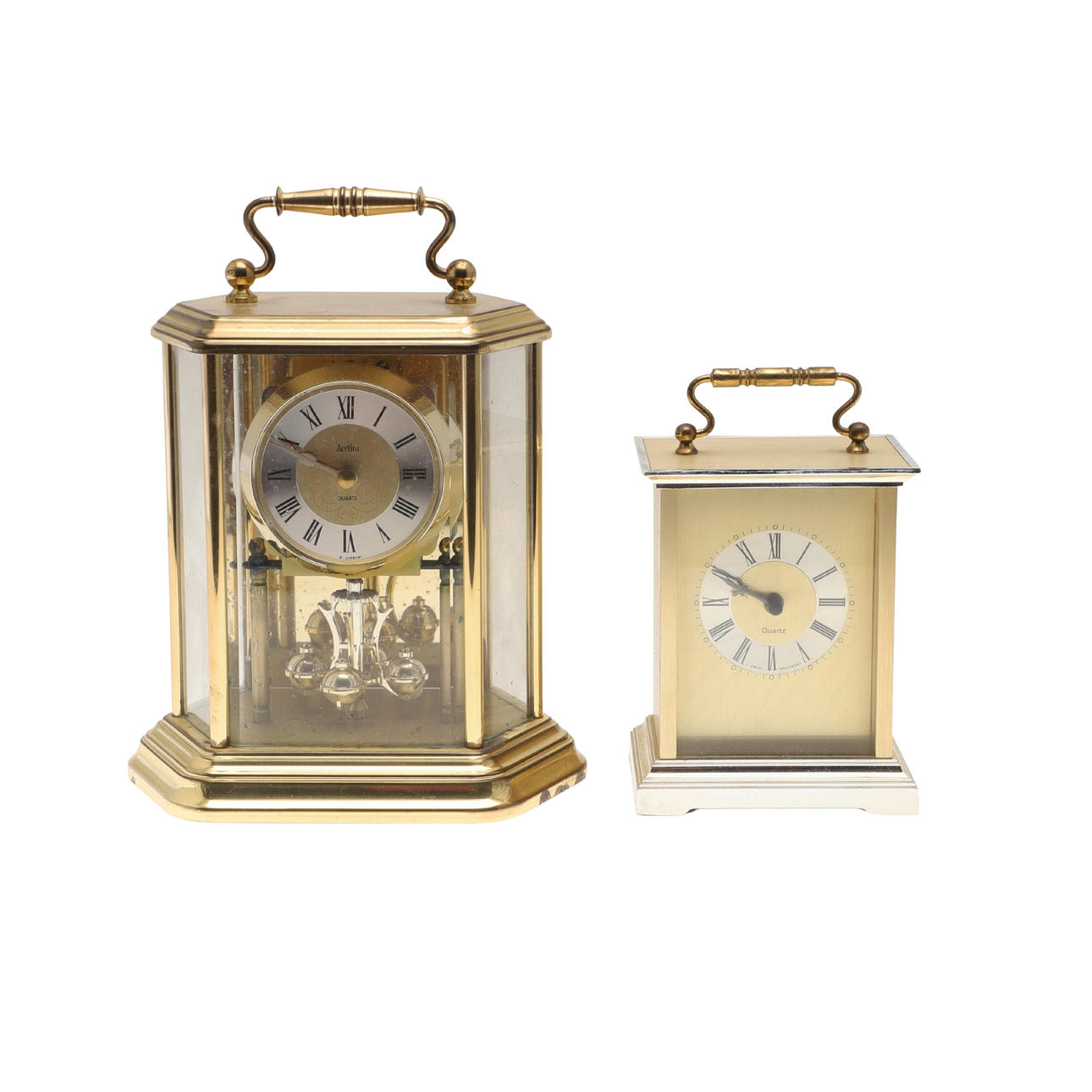 AN ANNIVERSARY CLOCK AND A CARRIAGE CLOCK.