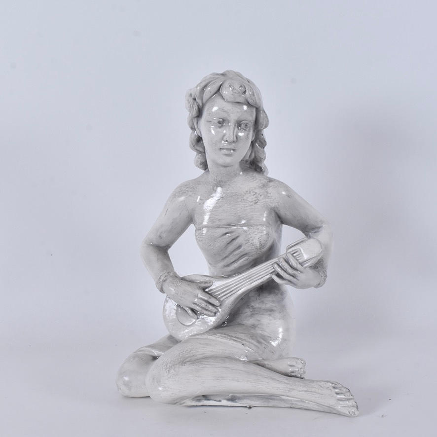 A sculpture, painted plaster, early 20th century.