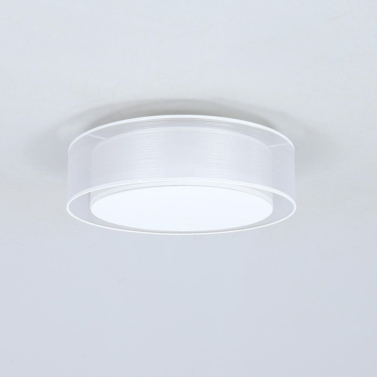 A contemporary Lumitech ceiling lamp.