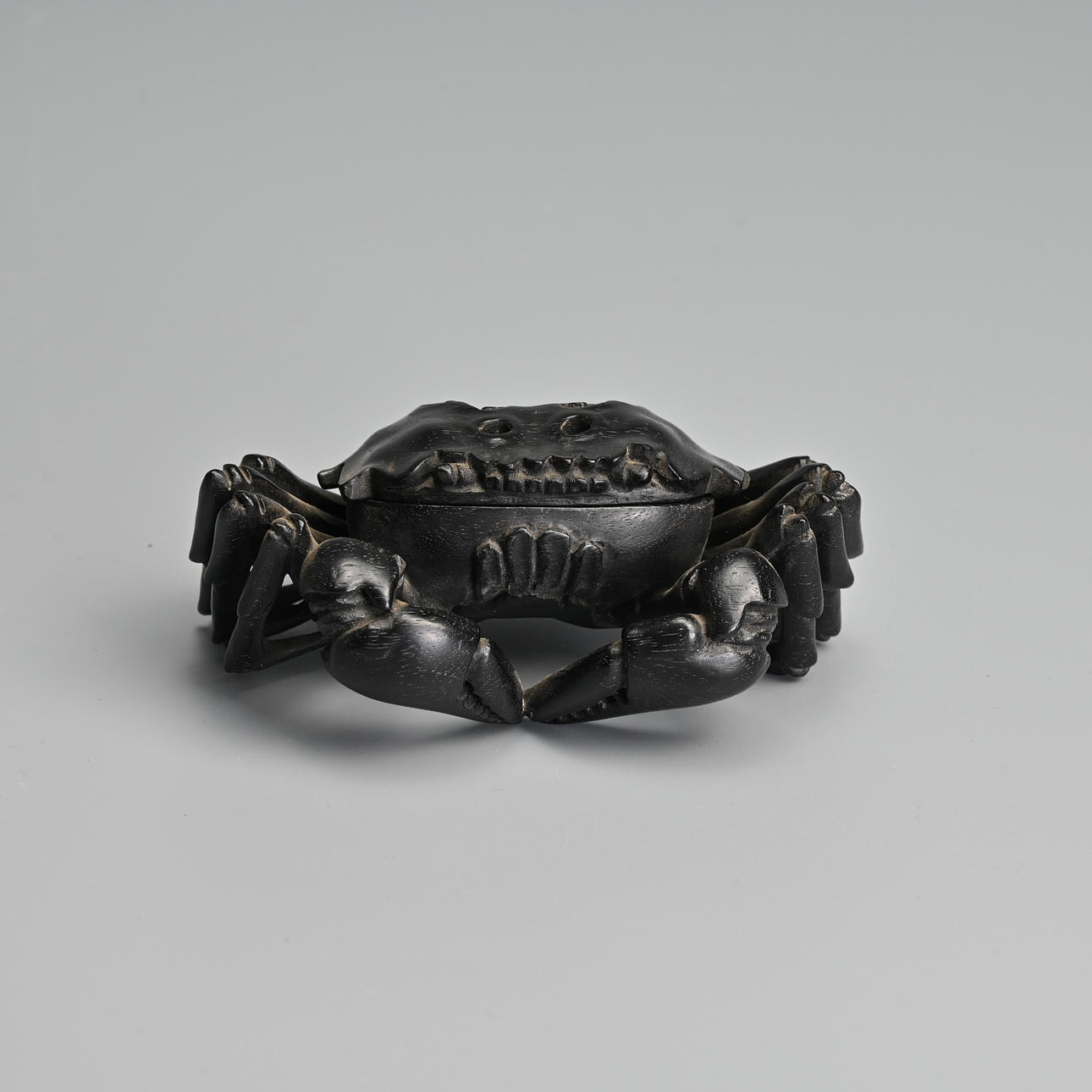 A CHINESE CARVED HARDWOOD BOX AND COVER IN THE FORM OF A MITTEN CRAB ...