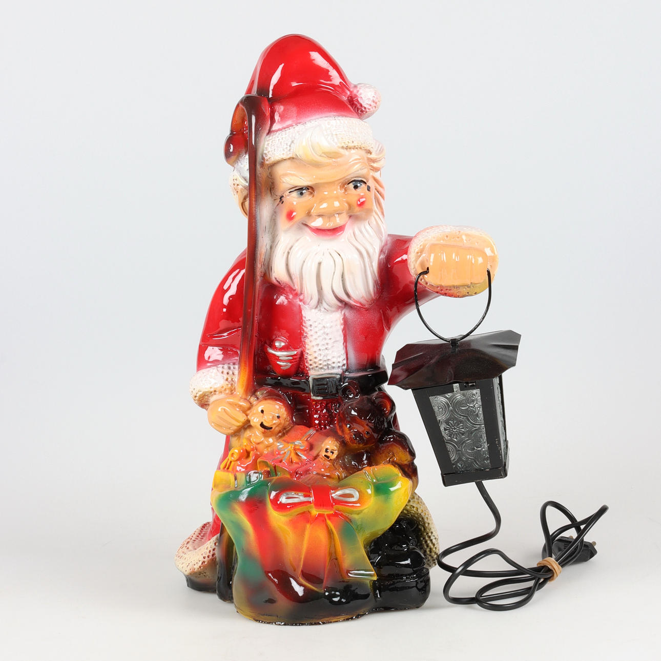 A plastic TOMTE with a lantern, 19/2000's.