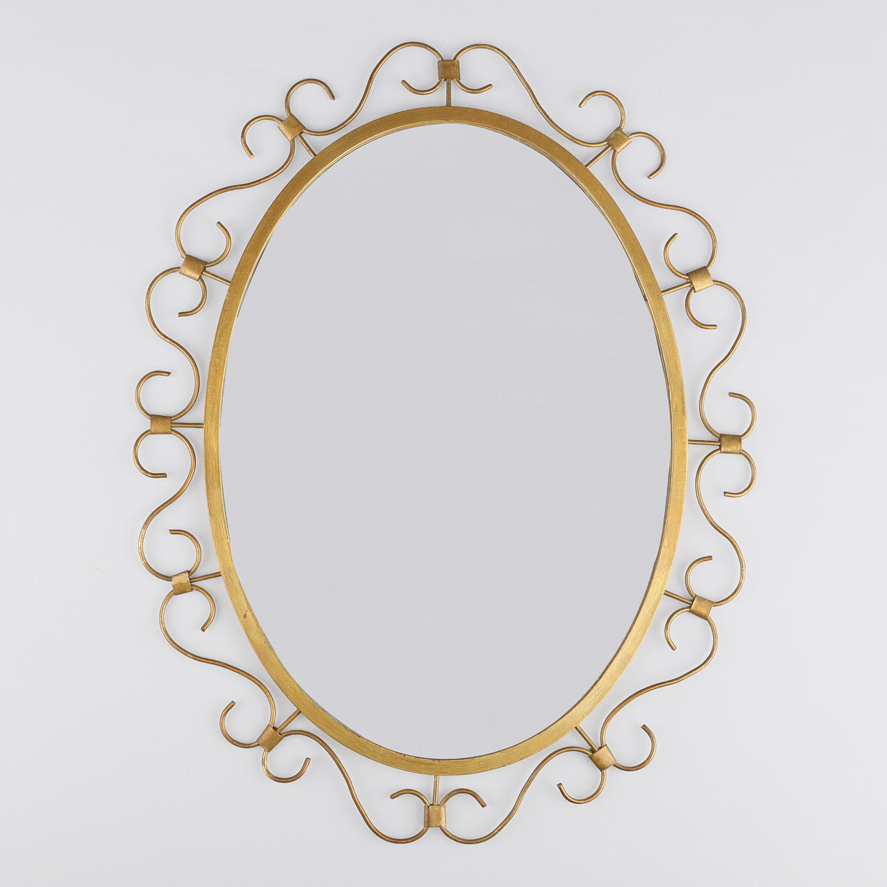 DANISH DESIGN. Oval mirror with brass frame, mid 1900s.