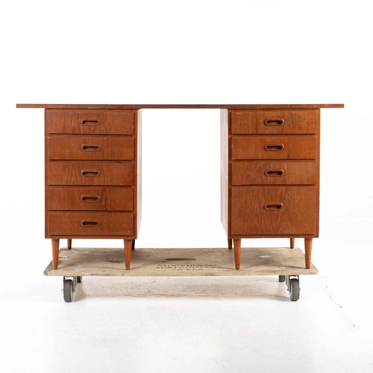 A teak desk, 1950s/60s.