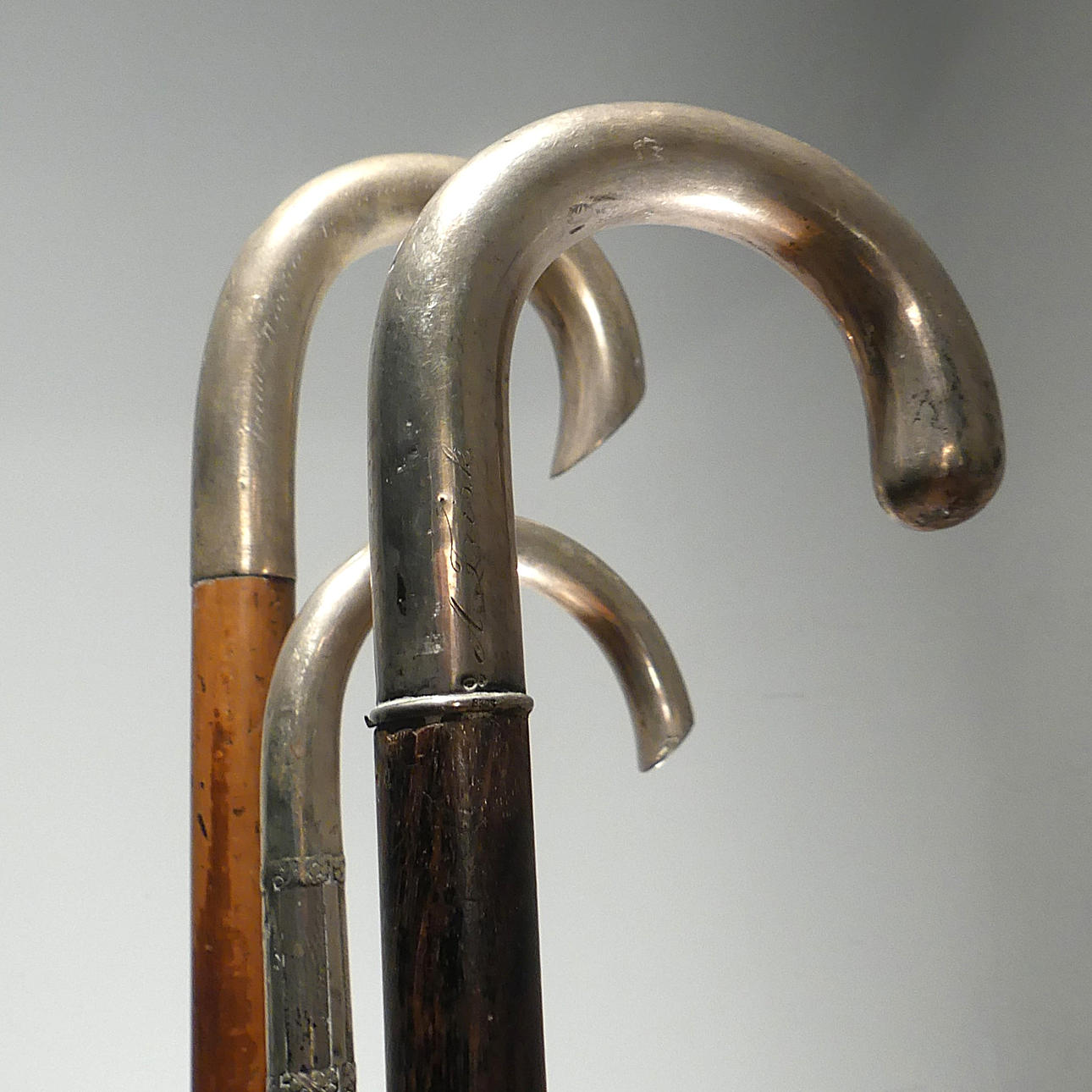 CRUTCHES/CANES with handles in silver.