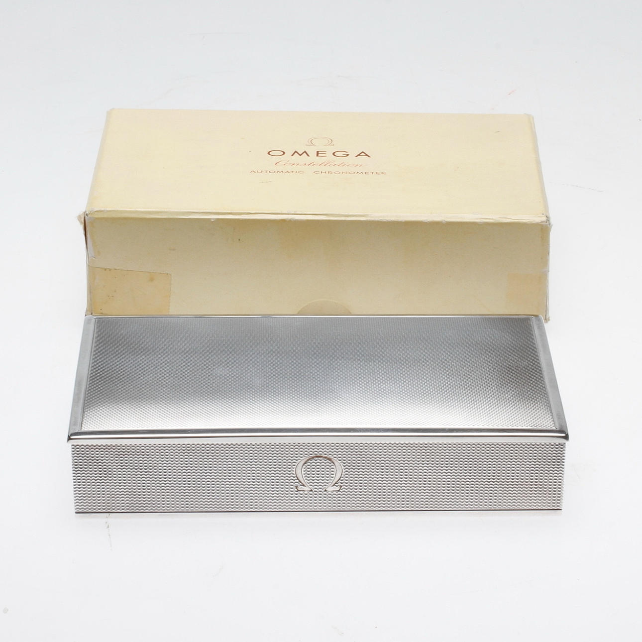 ETUI/ASK, silver samt kartong, Omega Constellation automatic chronometer, 1950-tal.