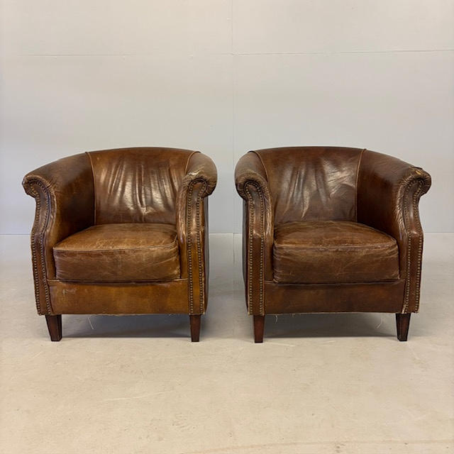 LEATHER CLUB ARM CHAIRS.