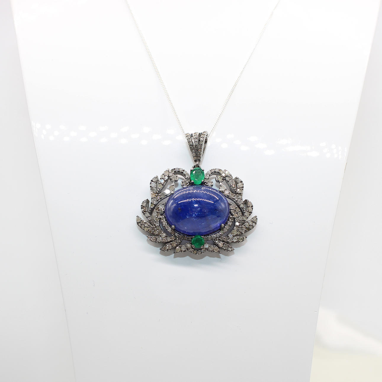 TANZANITE, EMERALD & DIAMOND PENDANT.