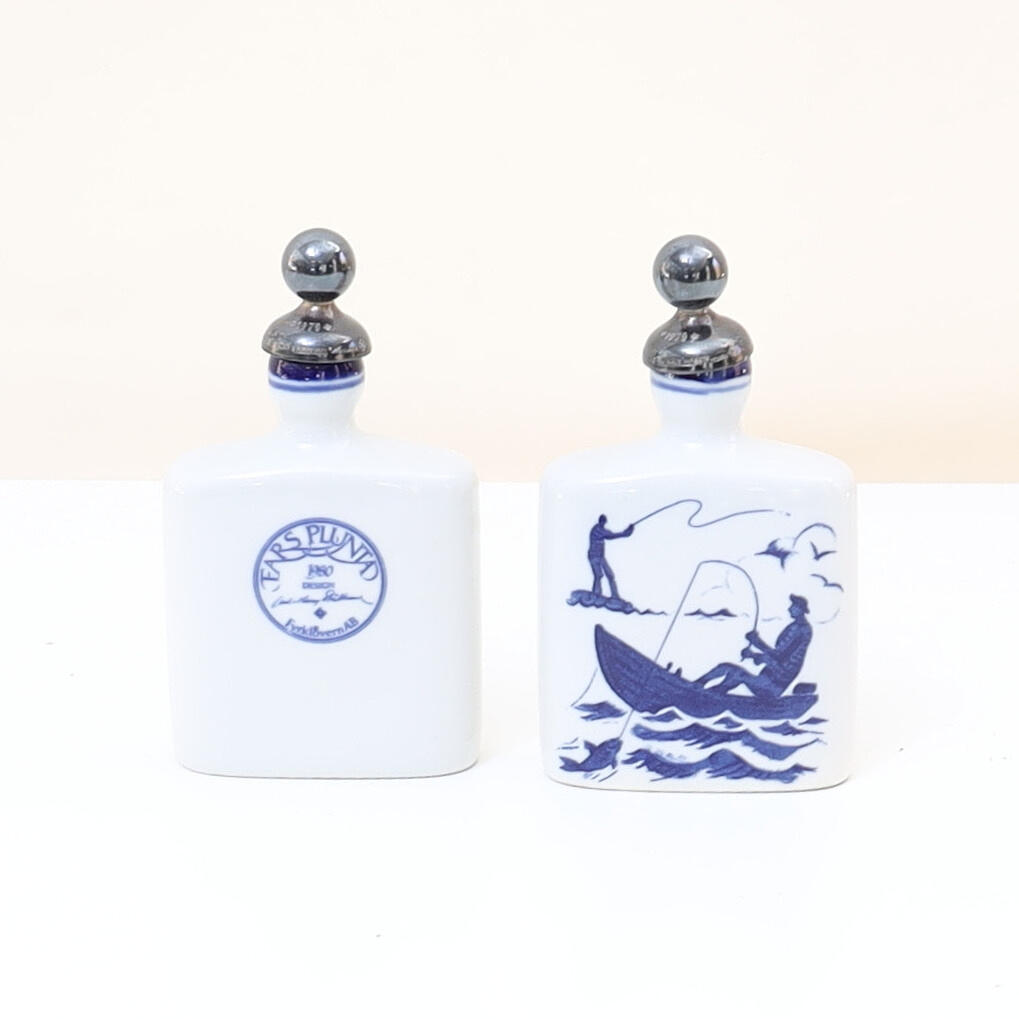 BOTTLES WITH STOPPERS MADE OF SILVER.