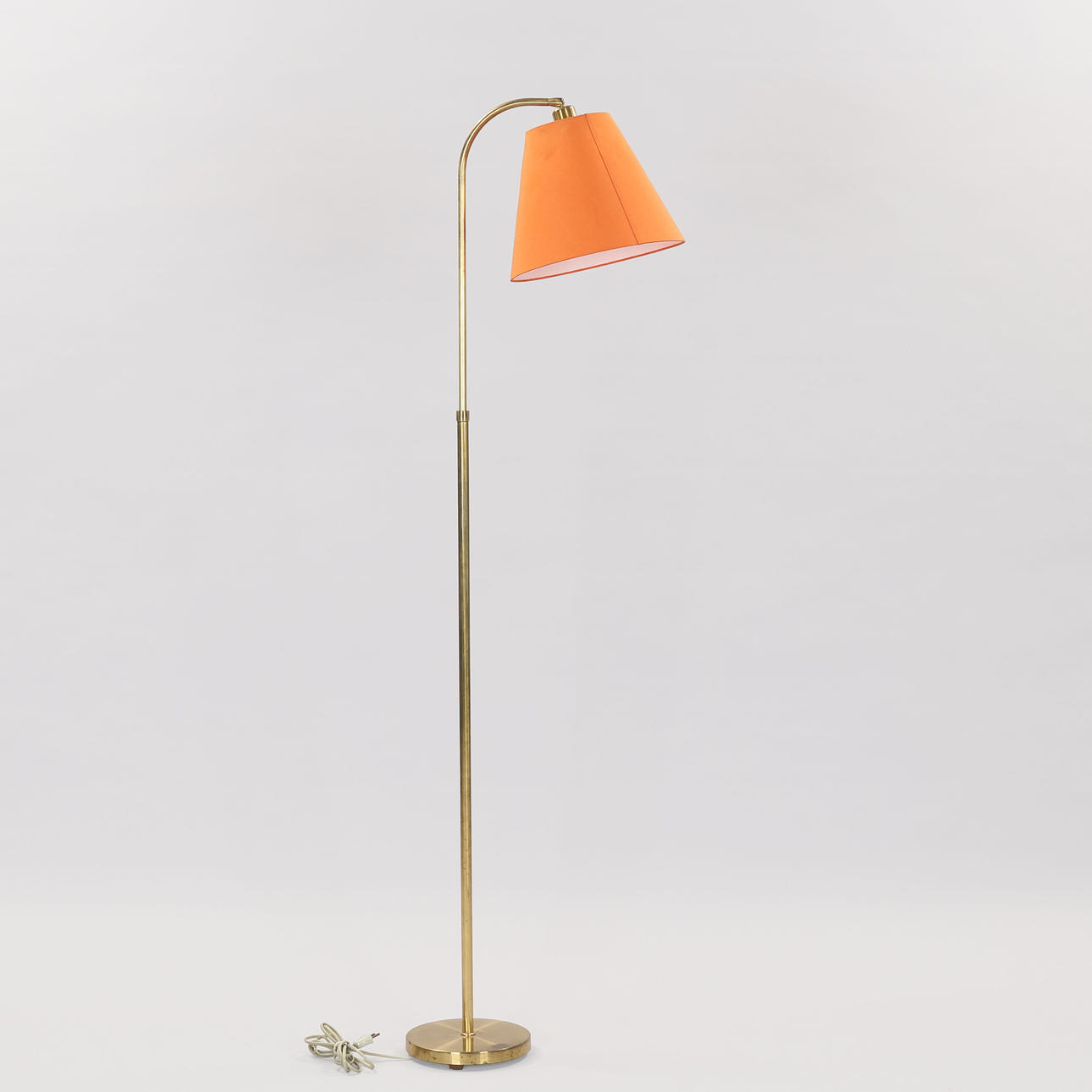 Brass floor lamp, height adjustable. 20th century middle Denmark.