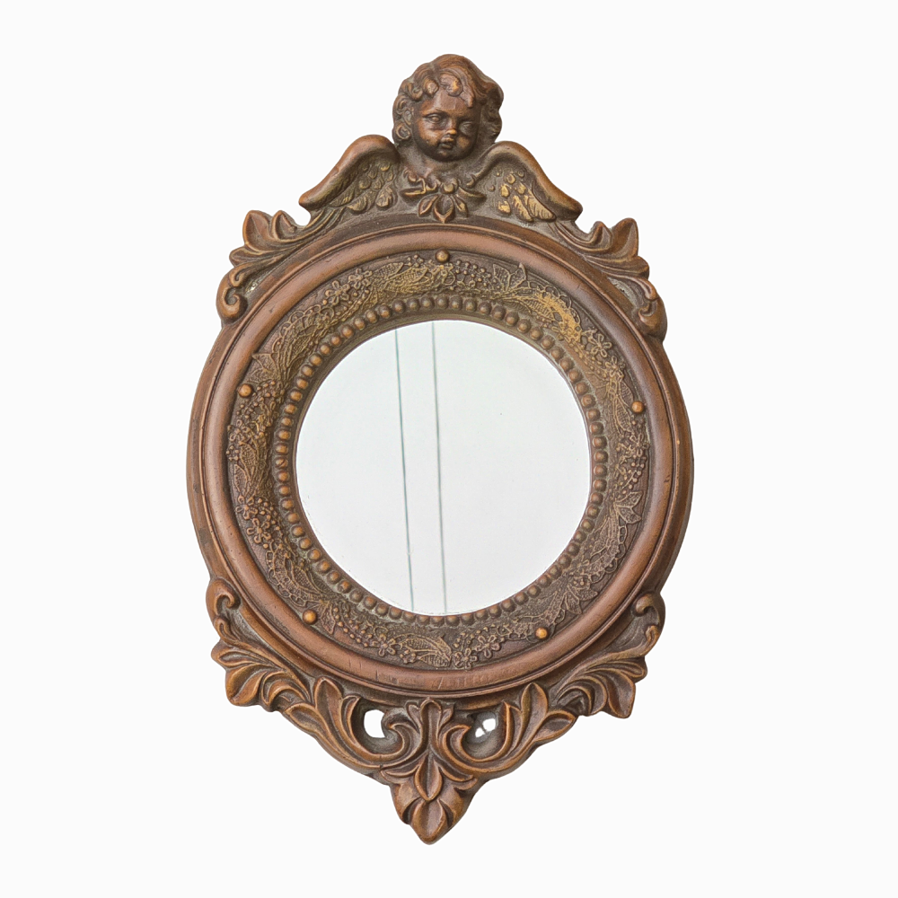 MIRROR WITH LITTLE ANGEL ARMBAND.