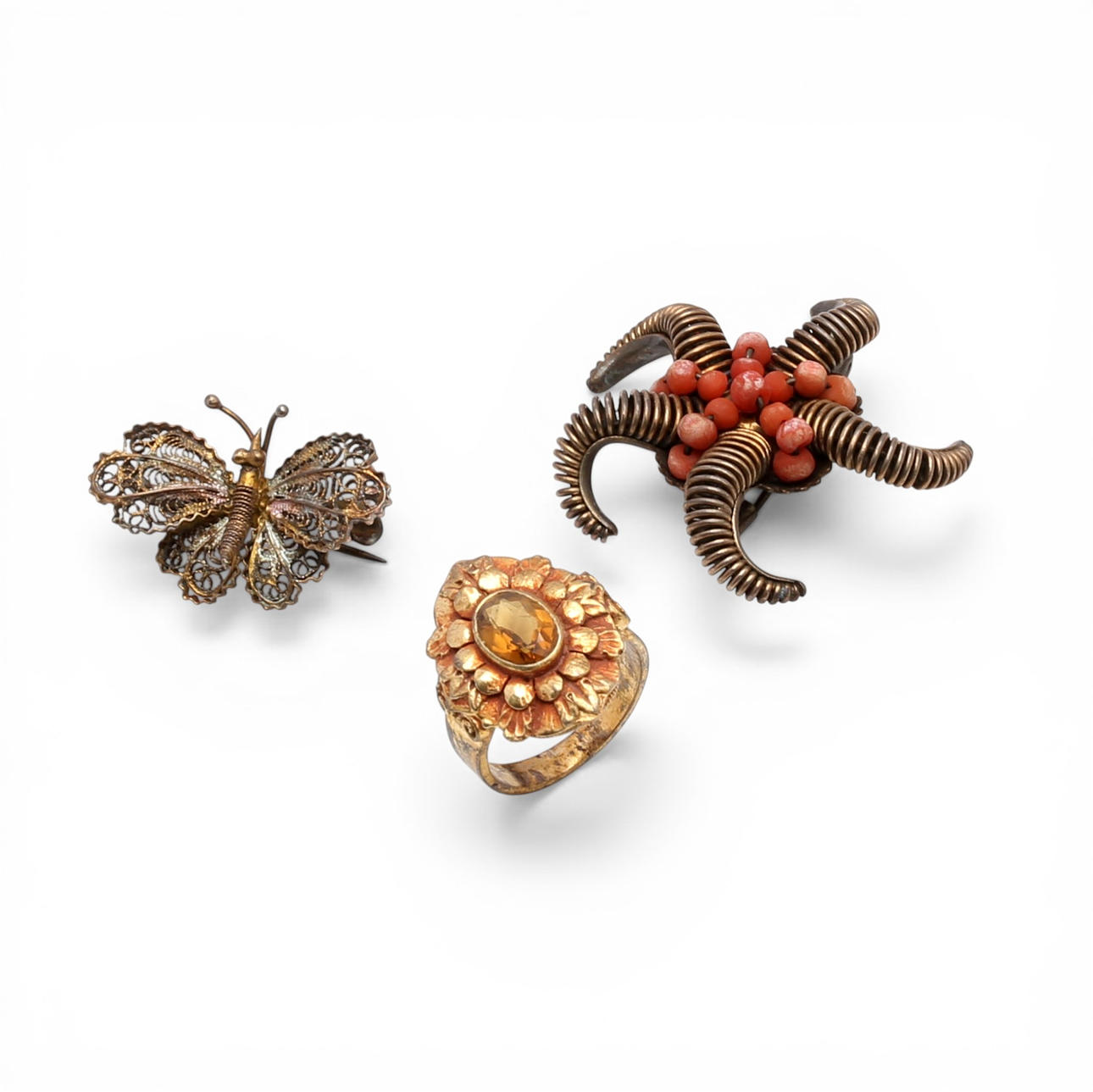 Two brooches and a ring in silver, mid 20th Century.