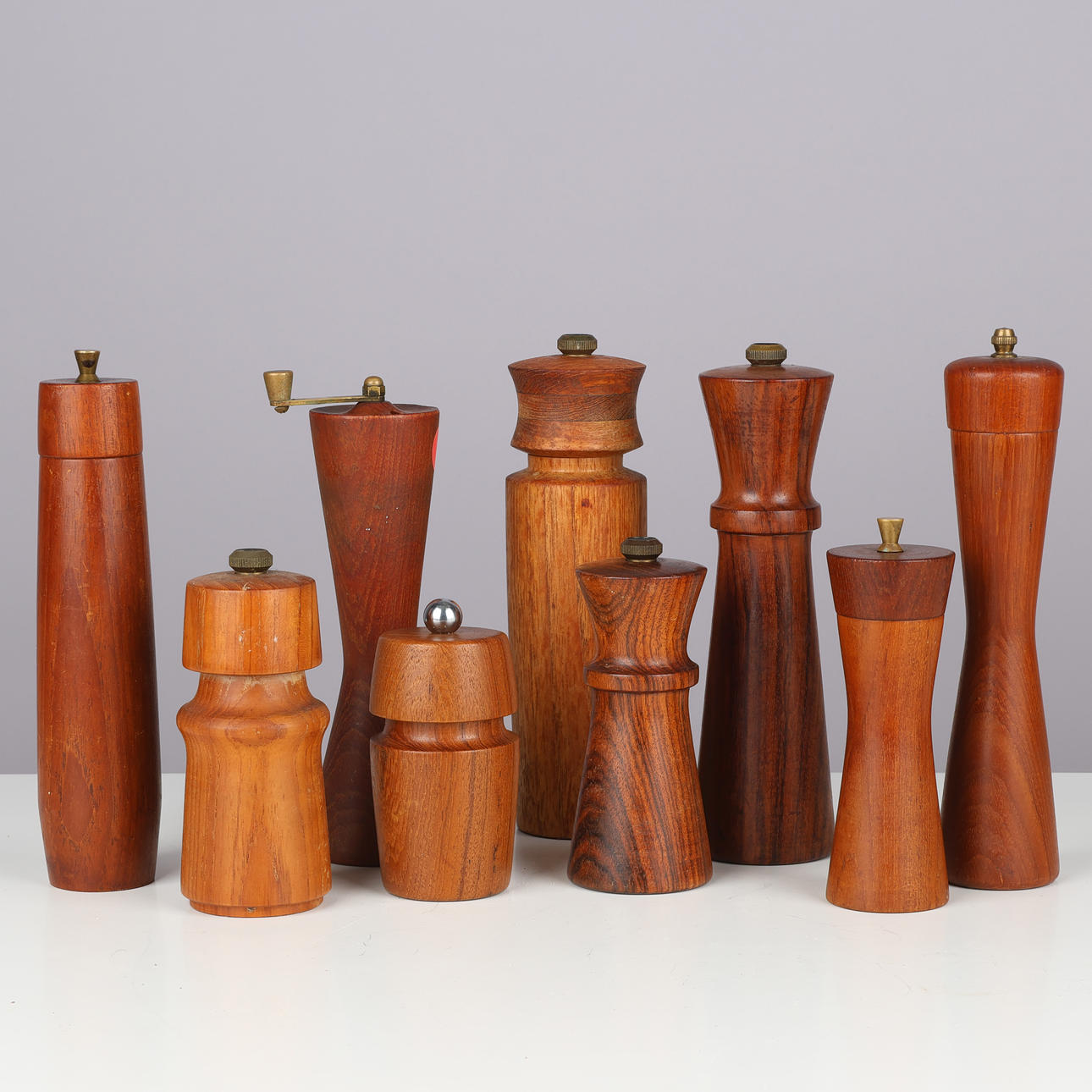 DANISH DESIGN. A collection of teak and rosewood pepper mills