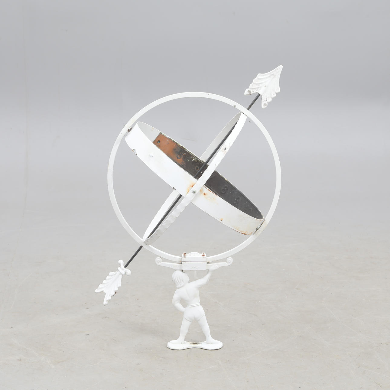 A metal sundial, 20th century.