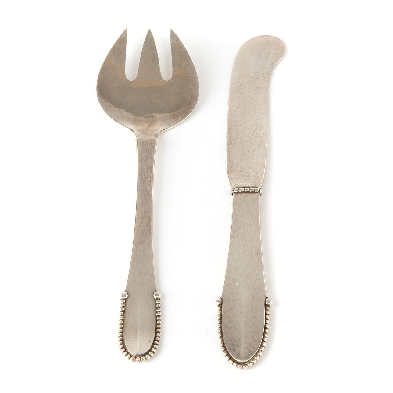 GEORG JENSEN, a silver fork and knife.