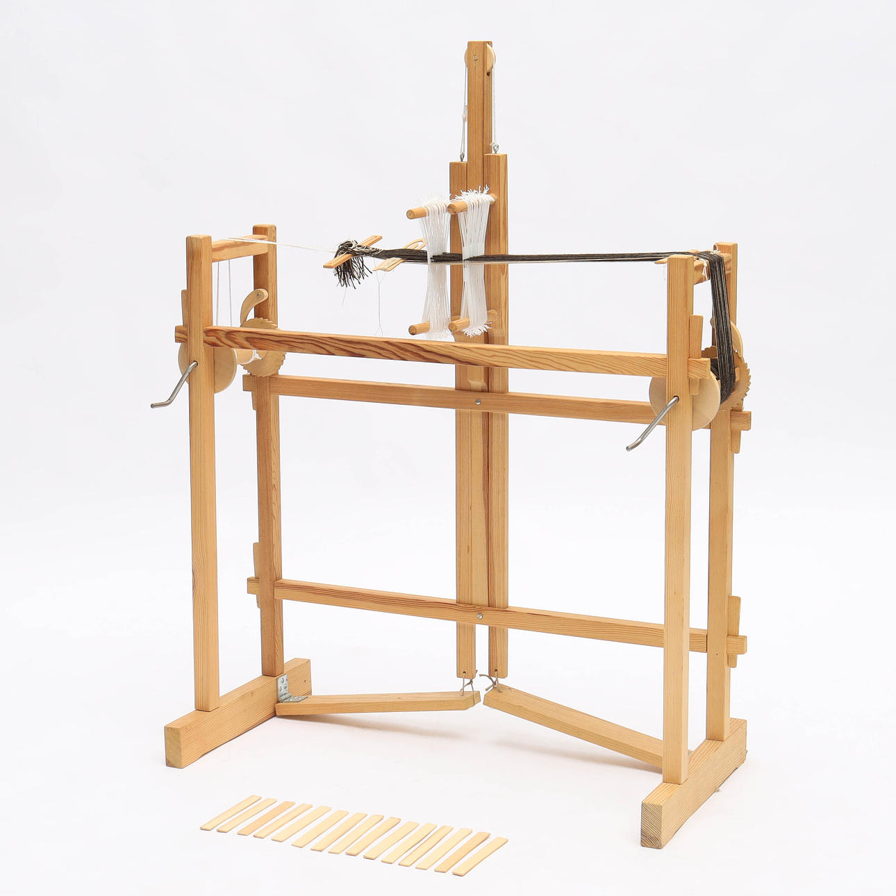 A 20th century pine ribbon loom.