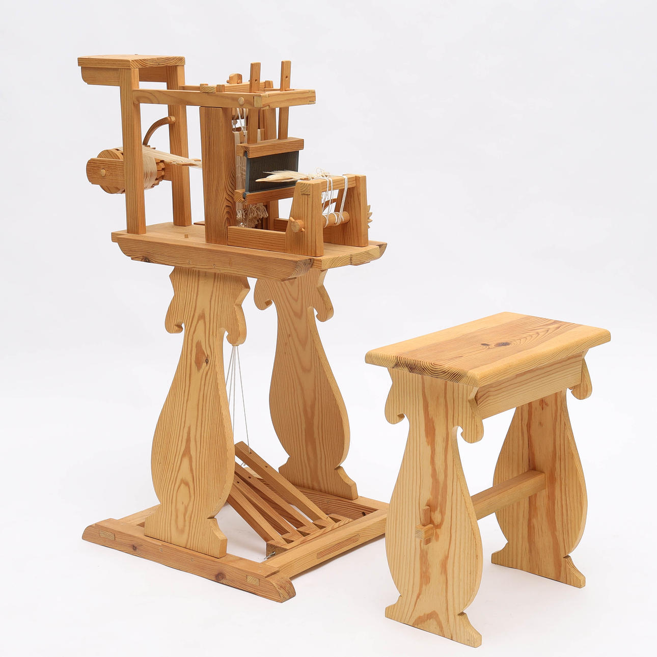 A ribbon loom with stool, pine, 20th century.