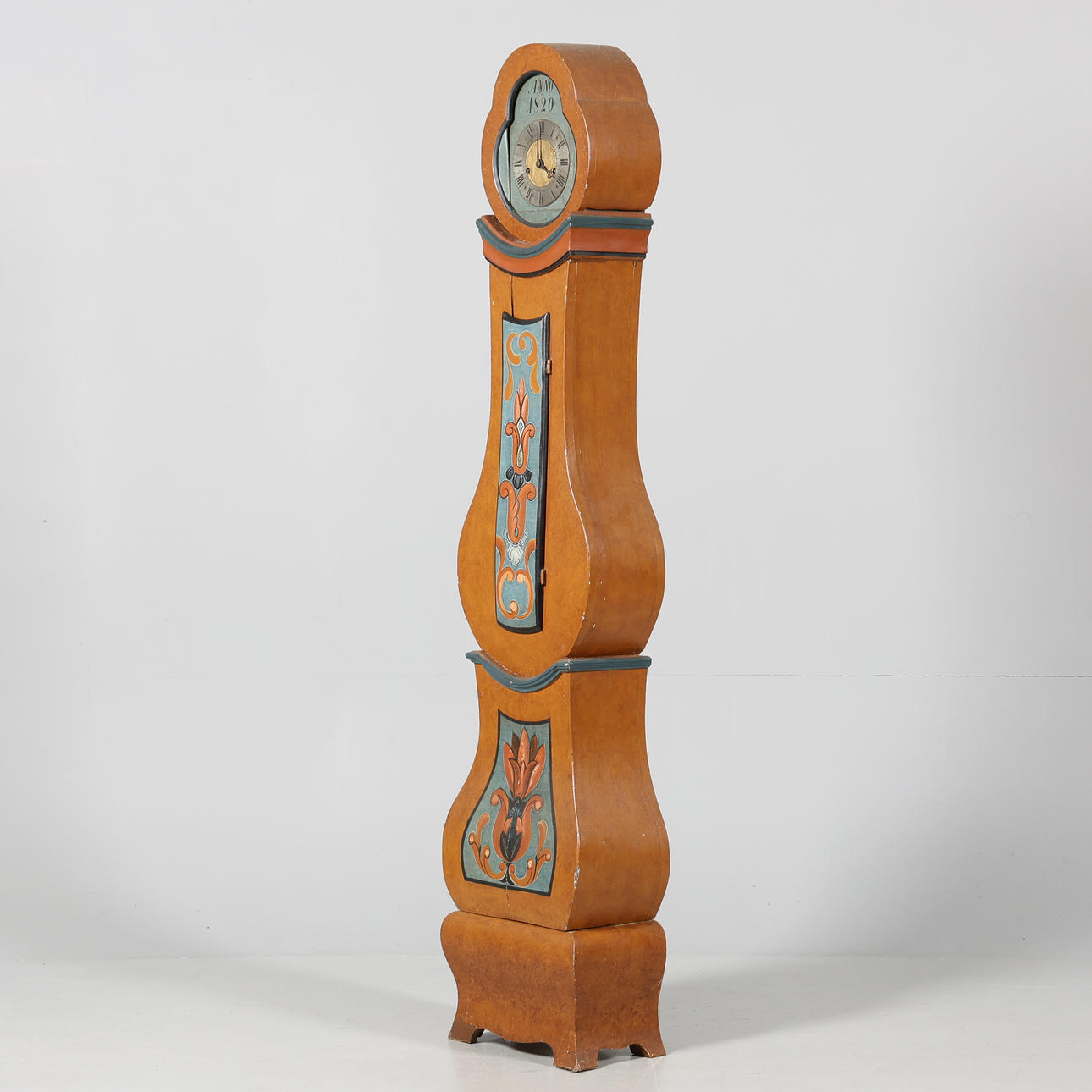 An almoge floor clock, dated 1820.