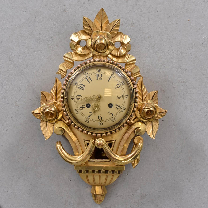 WALL CLOCK, gilded wood and stucco.