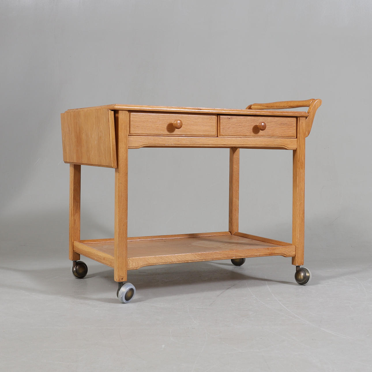 An oak dining trolley, 20th century.
