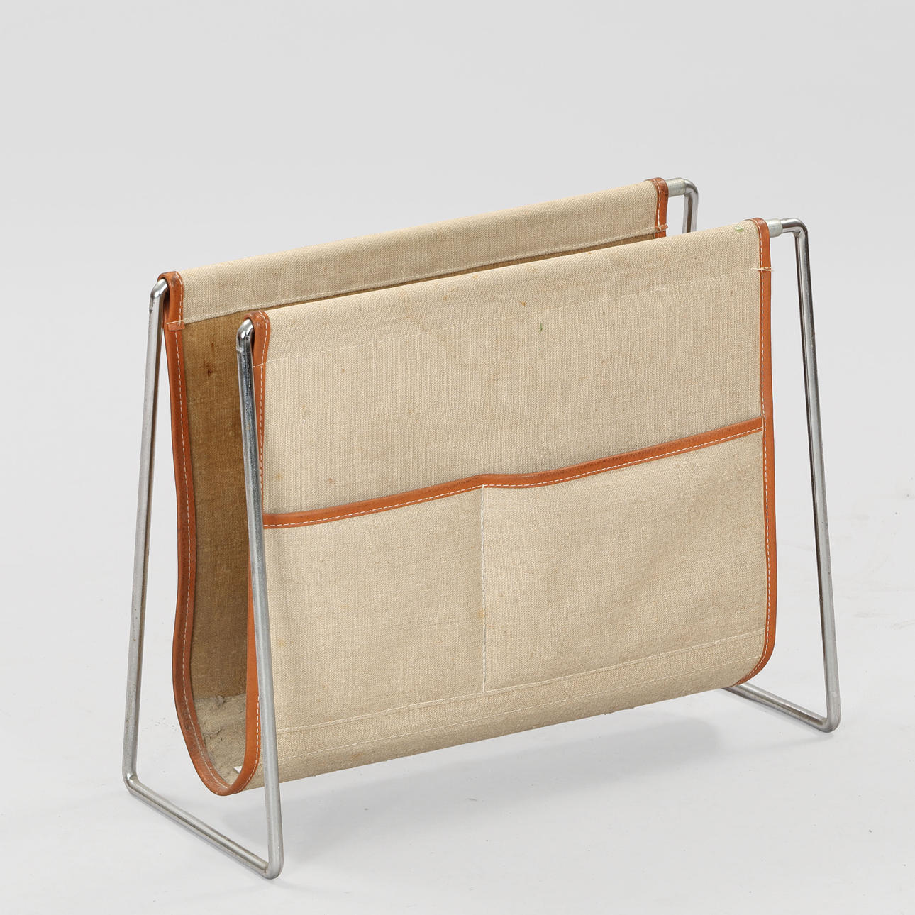 VERNER PANTON. Canvas and leather magazine rack, chrome-plated