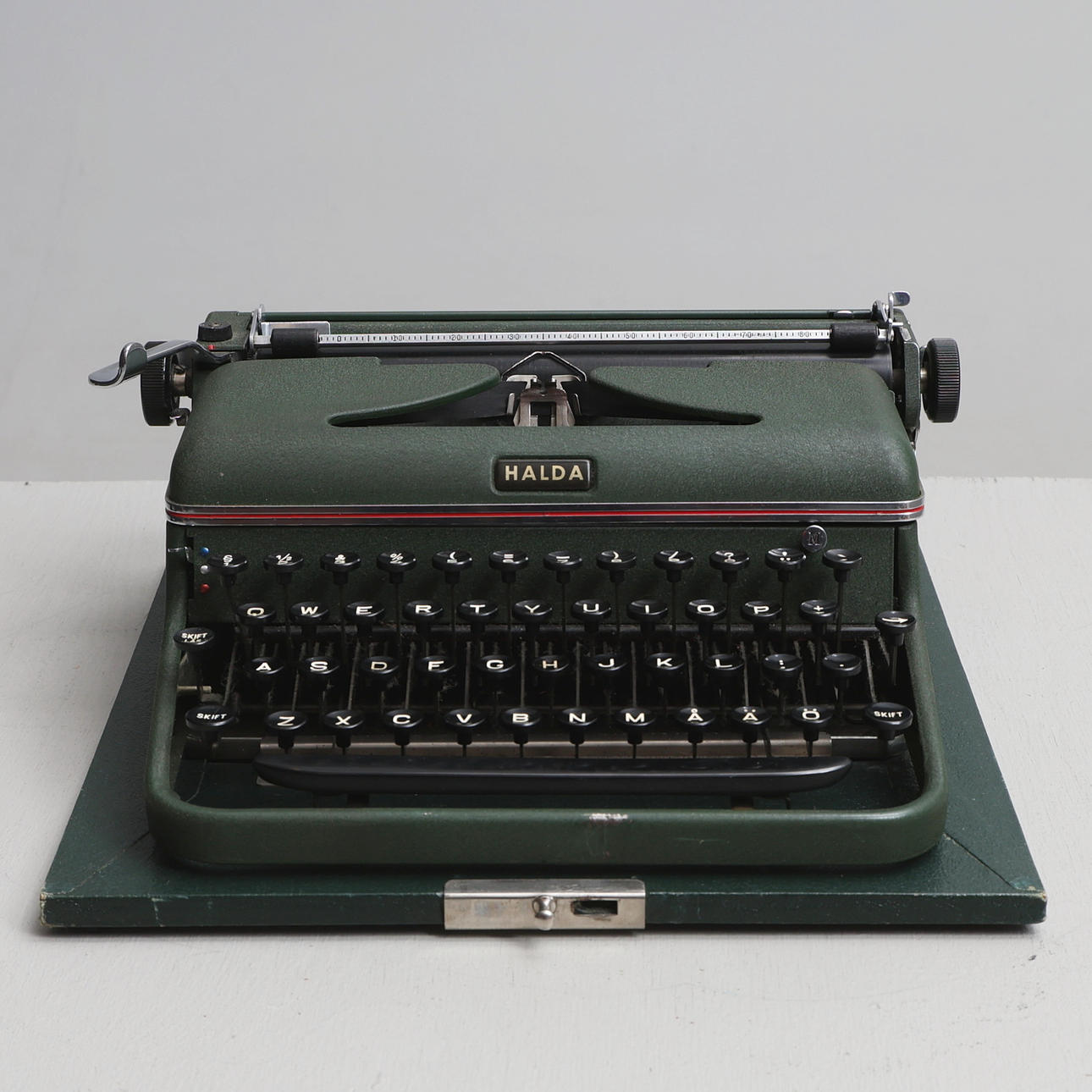 A 20th-century Halda typewriter in a bag.