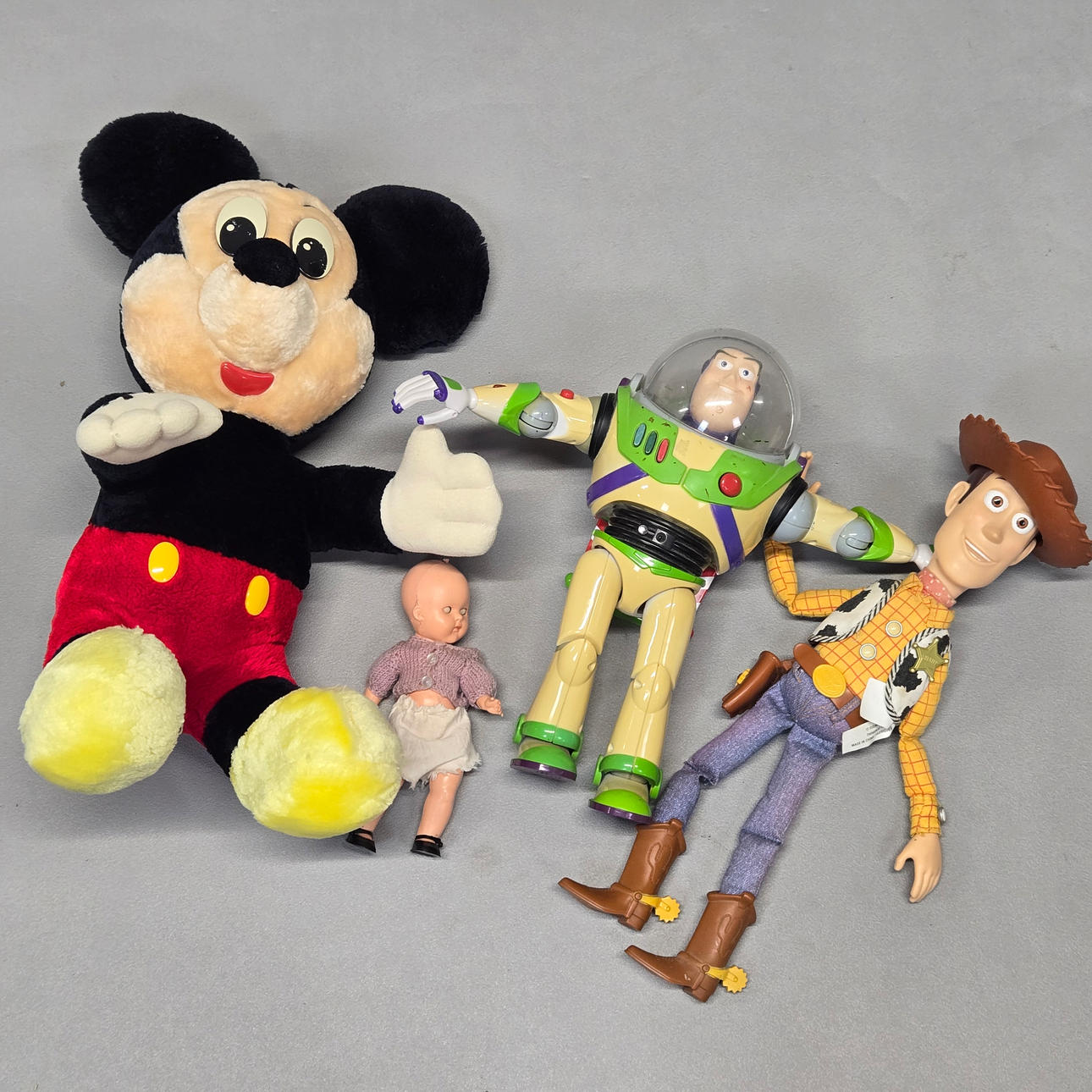 A QUANTITY OF TOYS INCLUDING MICKEY MOUSE.