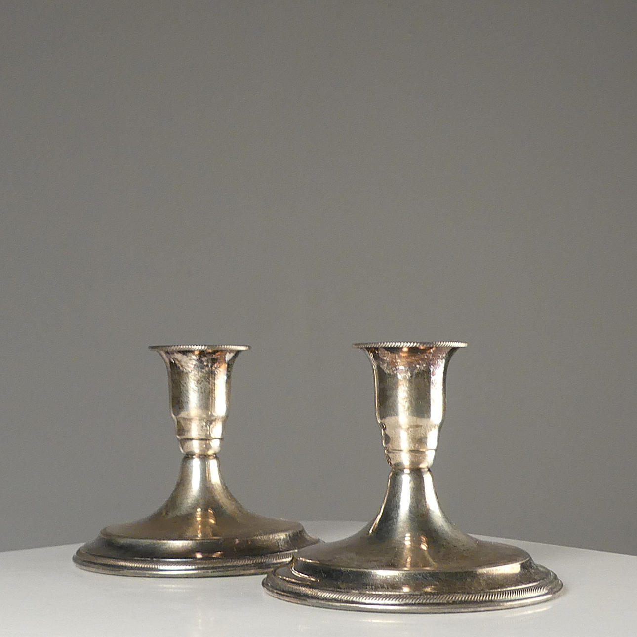 CANDLESTICKS, a pair of silver.