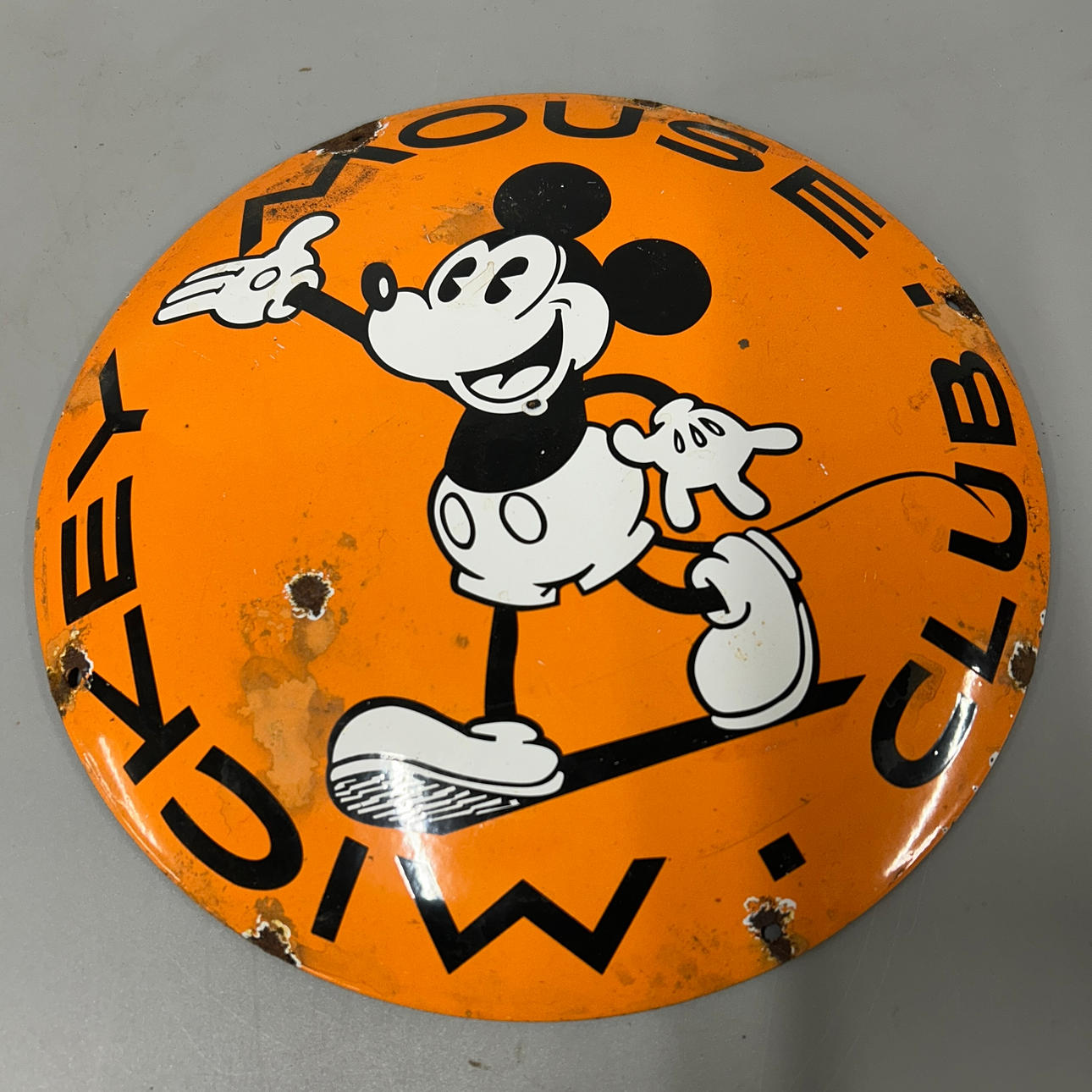 AN ENAMELLED CAST IRON SIGN.