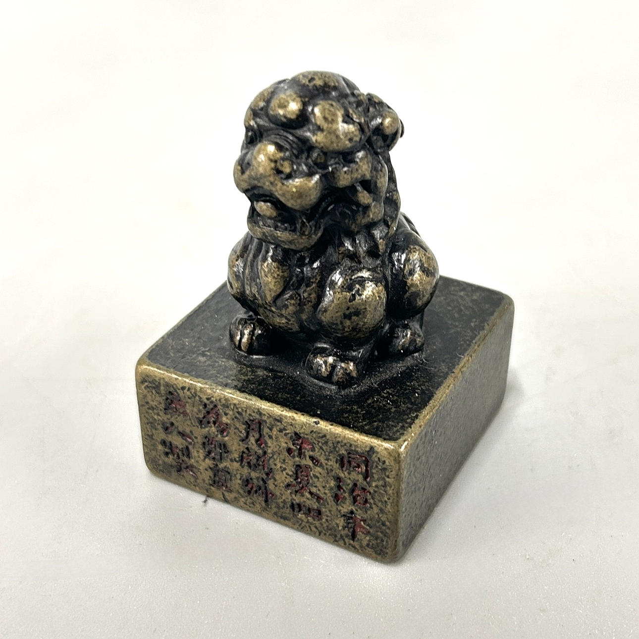 A BRONZE FO DOG SEAL.