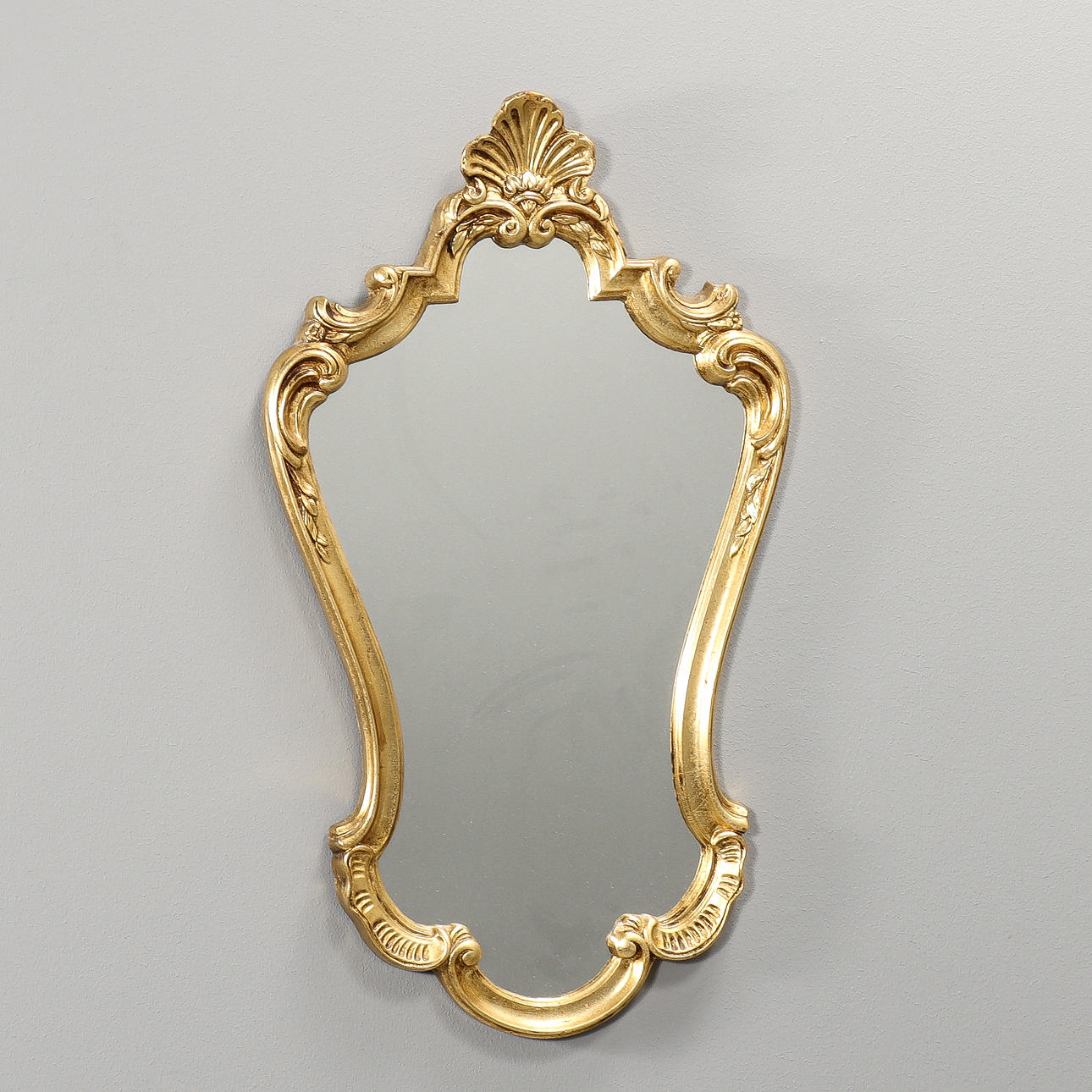 A rococo style mirror, modern production.