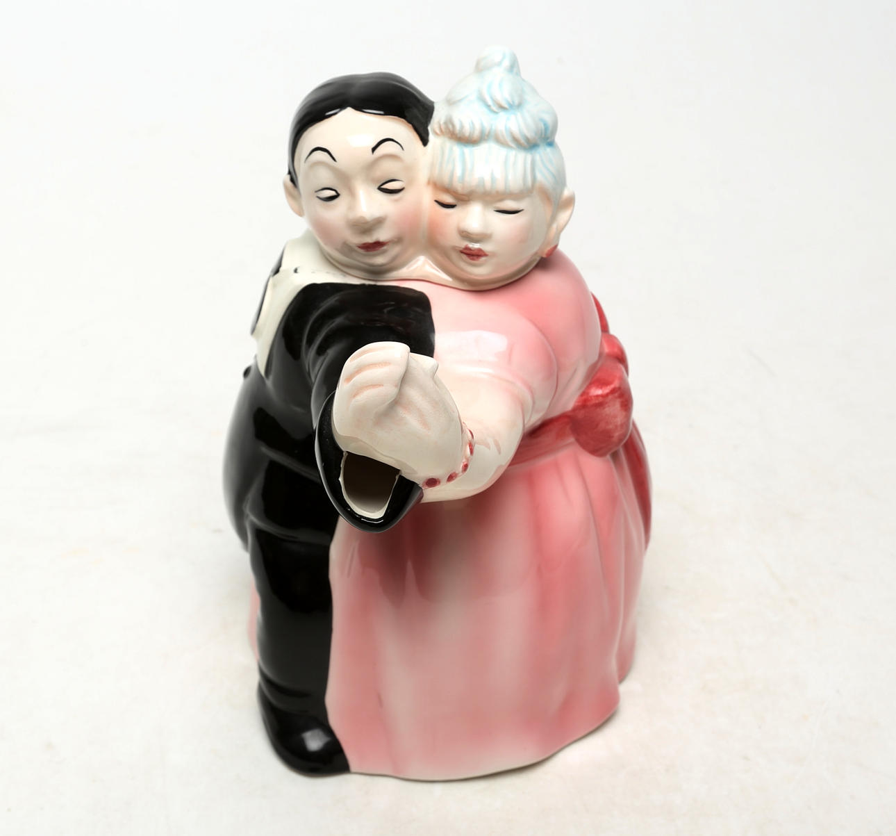 A porcelain teapot, dancing couple.