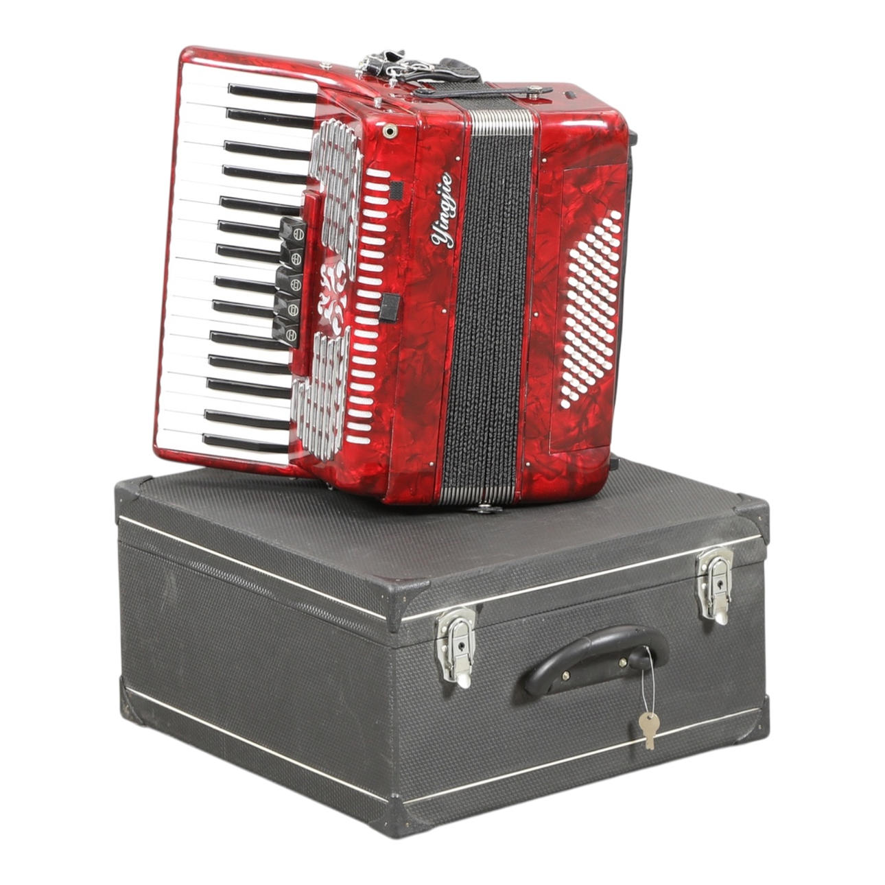 YINGJIE. Accordion in suitcase.