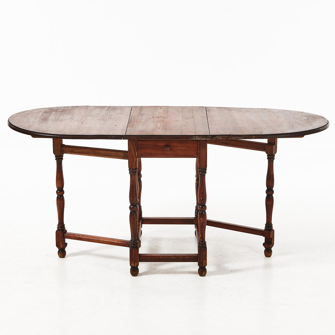 A wooden table, stained pine, boxes in sarg, 20th century.