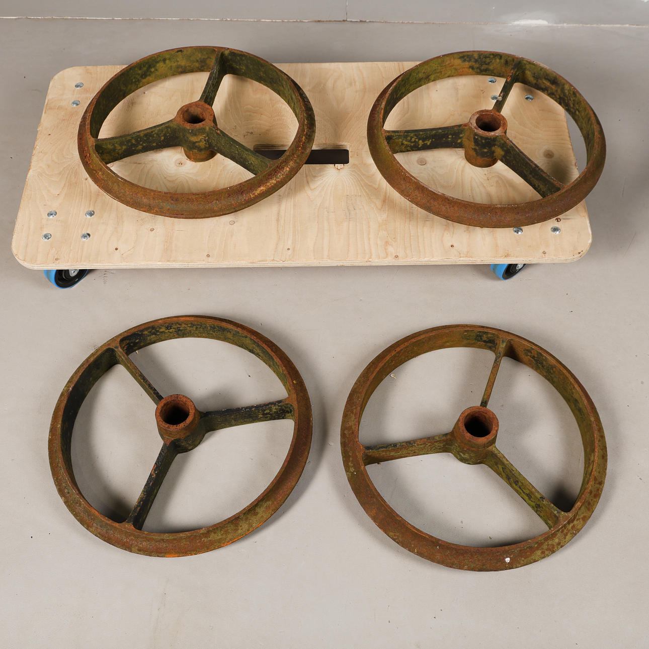 FOUR CAST IRON SHEPHERD HUT WHEELS (4).