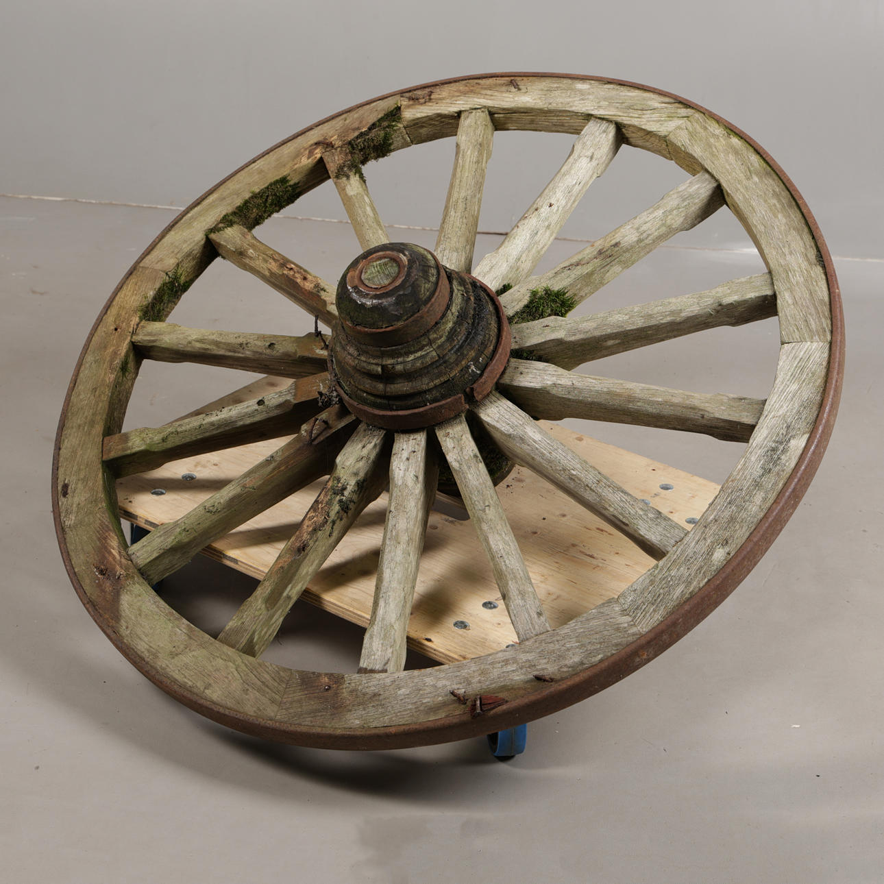 AN IRON BOUND SPOKED WAGON WHEEL.