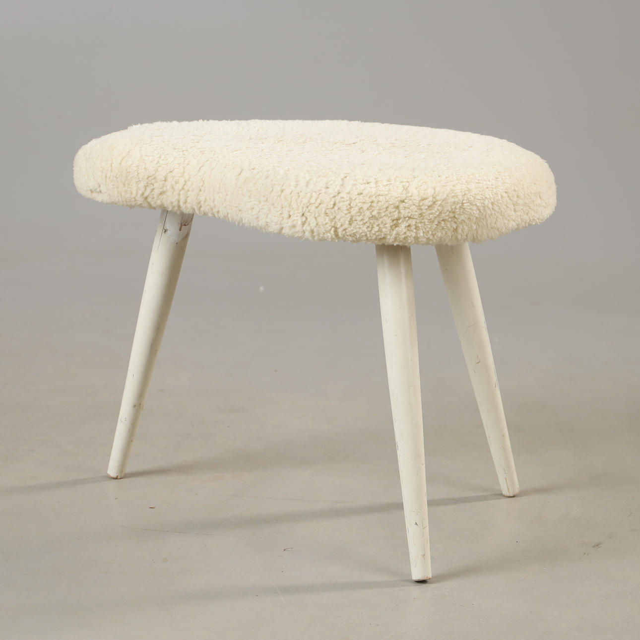 A sheepskin stool, mid 20th century.