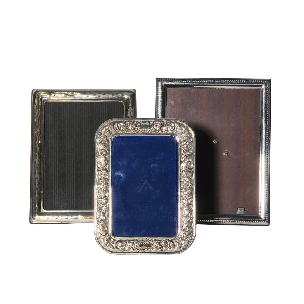 THREE FRAMES IN PUNCHED SILVER.