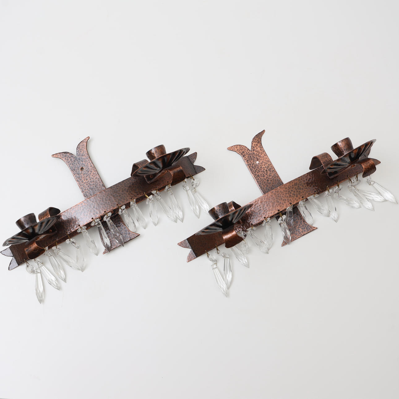 A pair of wall sconces, signed LL and dated 2010.