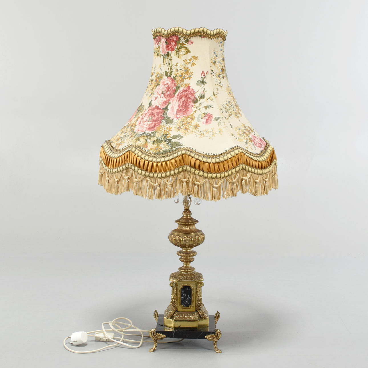 A brass, stone table lamp, prisms, 20th century.