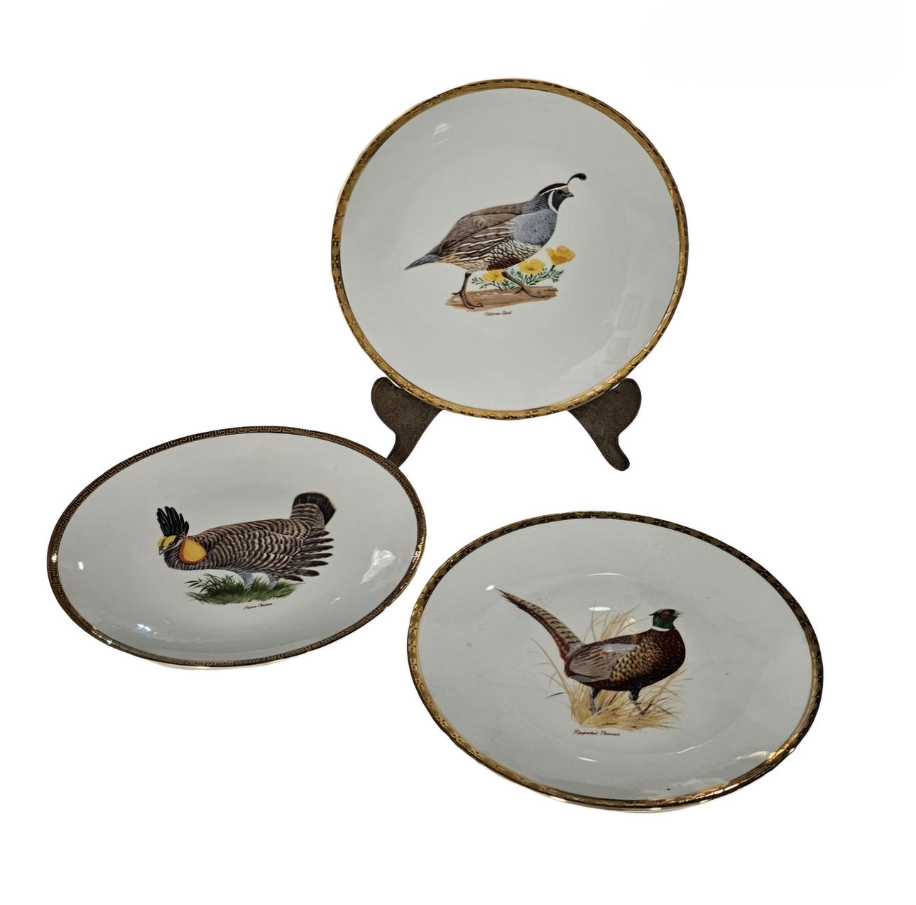Three ceramic plates with a bird motif.