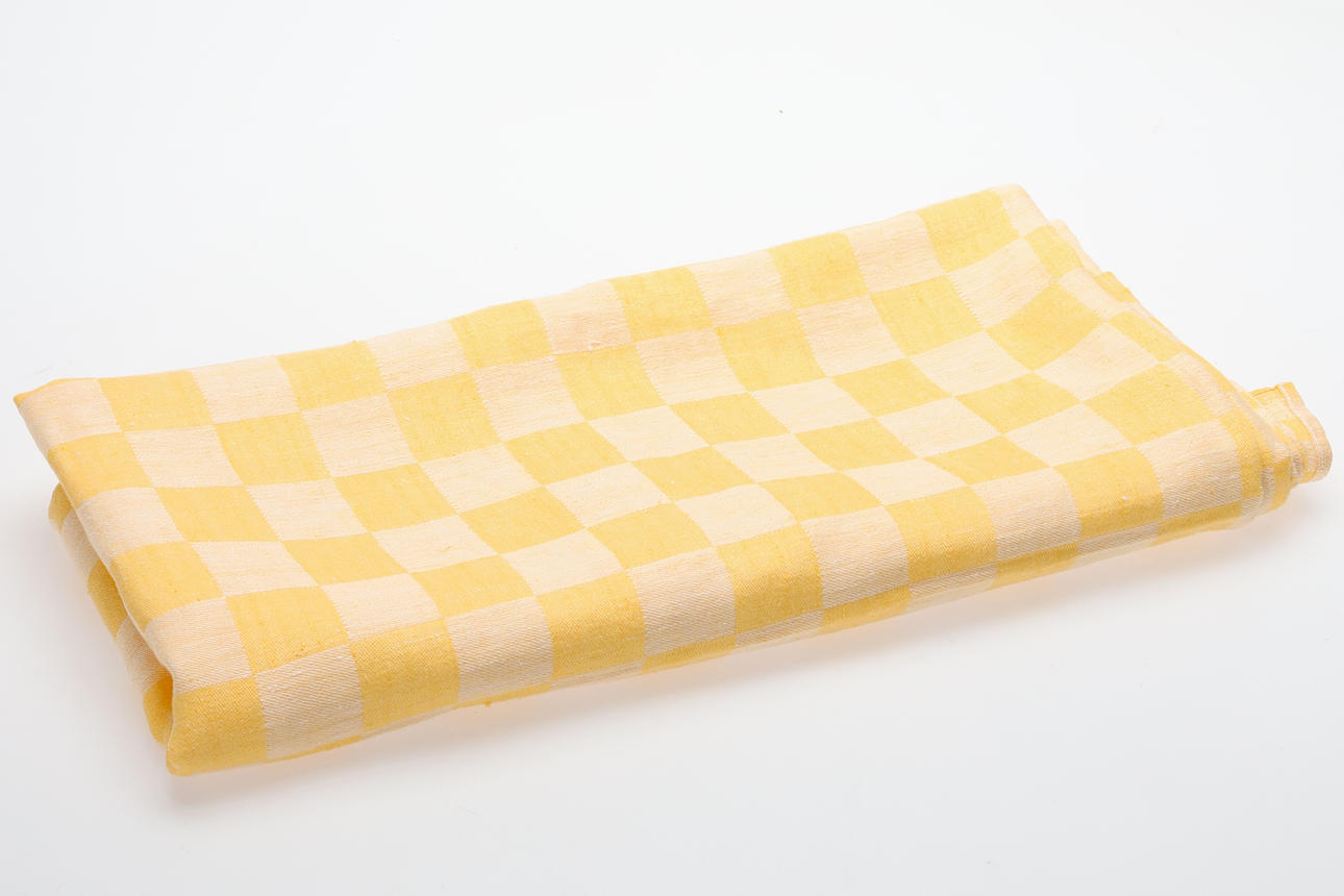 An Easter tablecloth, yellow/white checkered linen, 20th century.