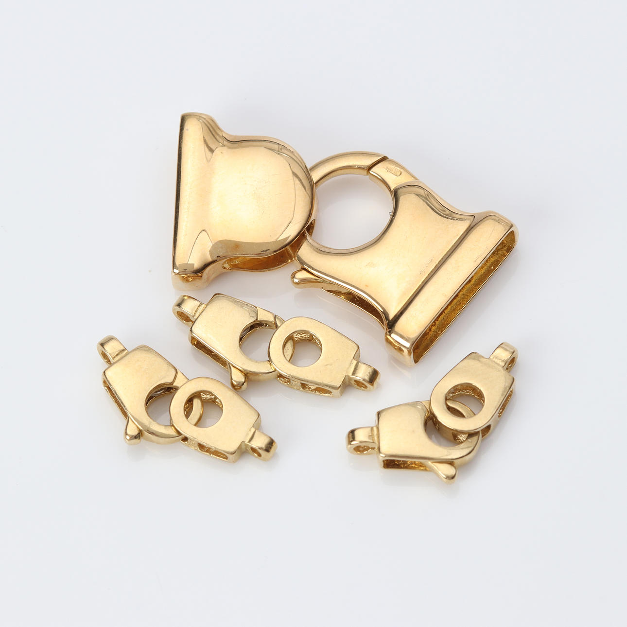 COLLIER LOCKS, FOUR PCS. 18k gold, weight approx. 10,2 grams.