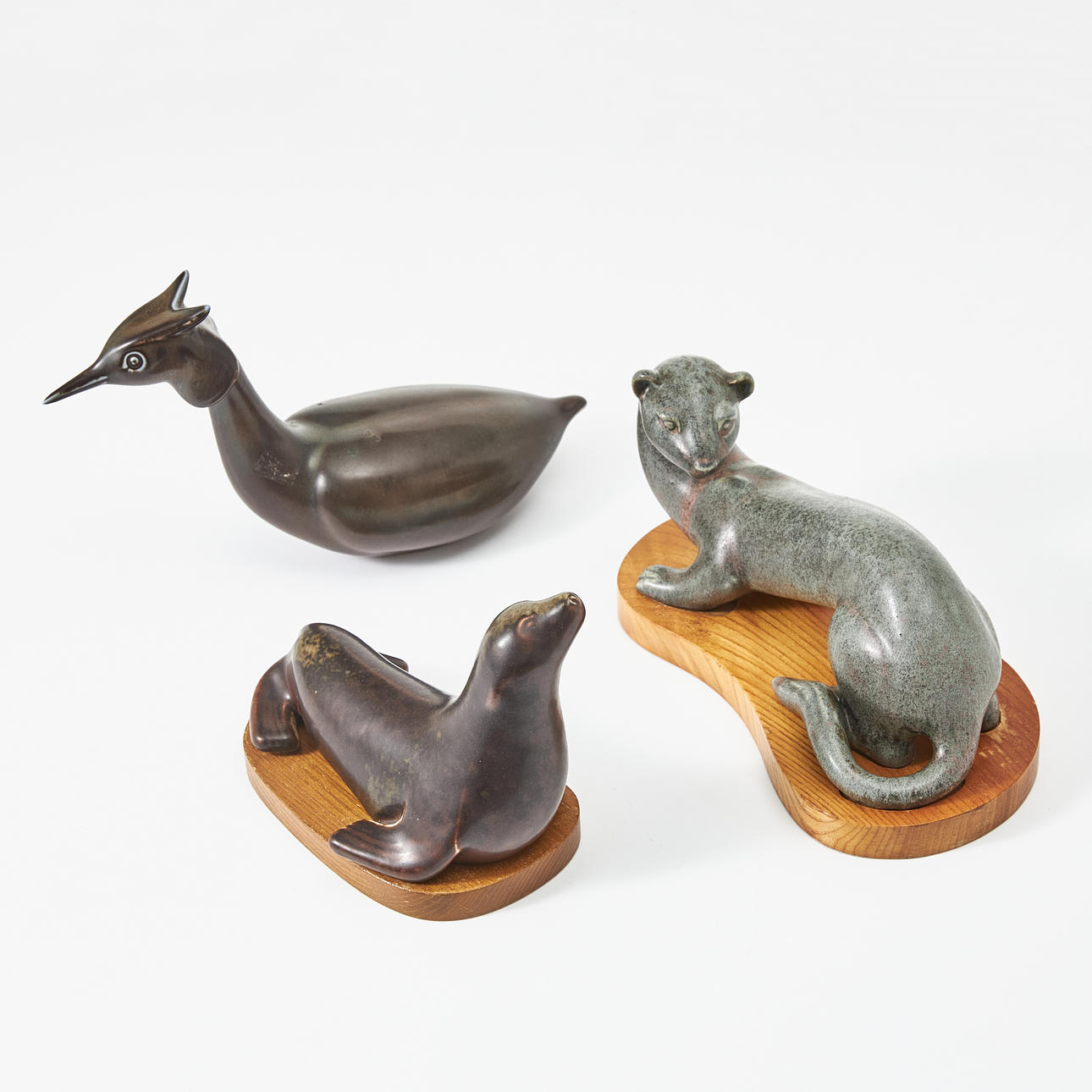 GUNNAR NYLUND. Three stoneware figurines, Rörstrand, in the form